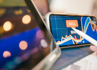 Trader across multiple markets reviewing Bitcoin Ethereum and forex options